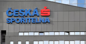 Feature image of Česká spořitelna's logo on the exterior of a modern building facade, symbolizing the bank's strong presence in the Czech financial sector.